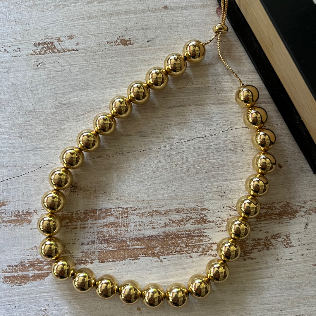 Collar Bolas Doradas