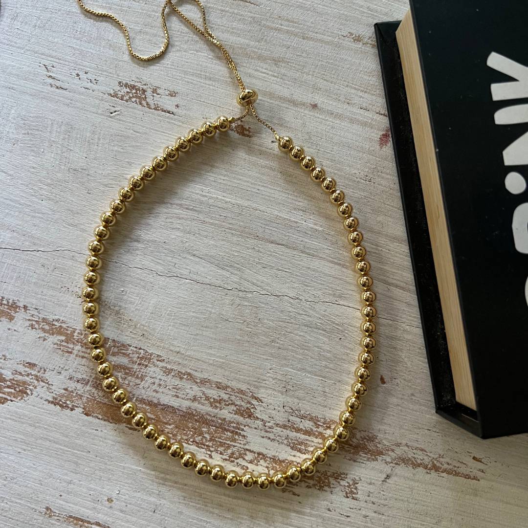 Collar Bolas Doradas