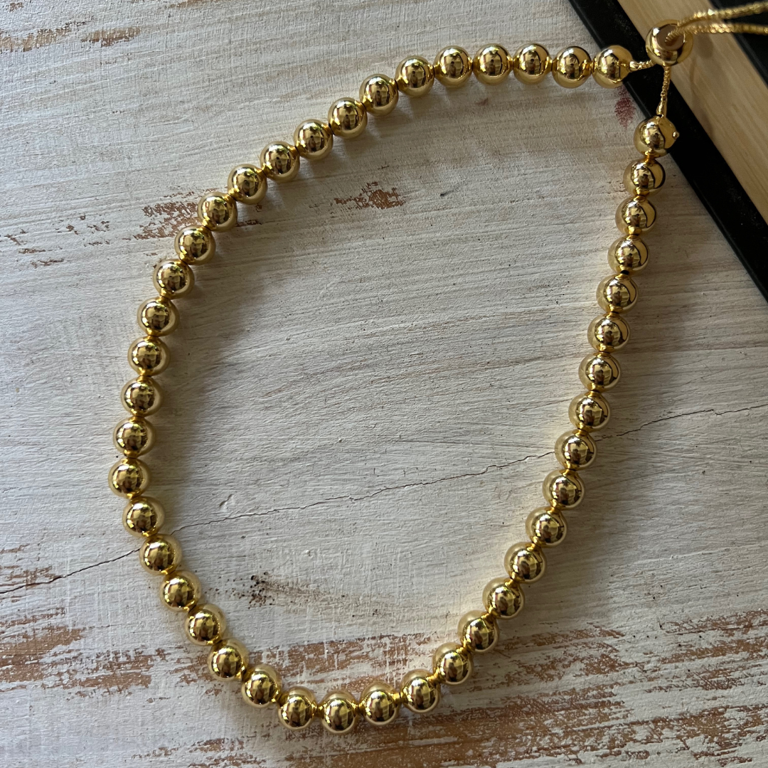 Collar Bolas Doradas